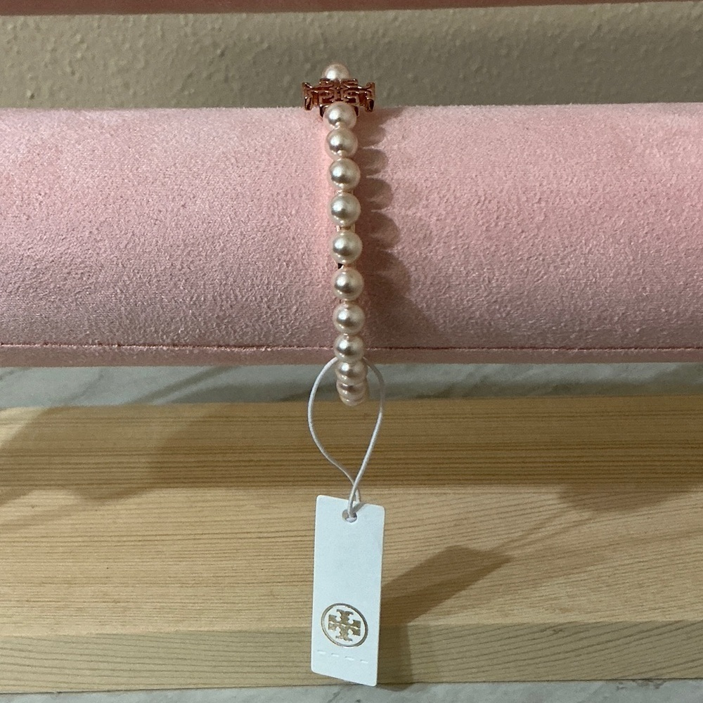 Tory Burch Logo Pearl and Rose Gold Tone Cuff Bracelet - Picture 2 of 6